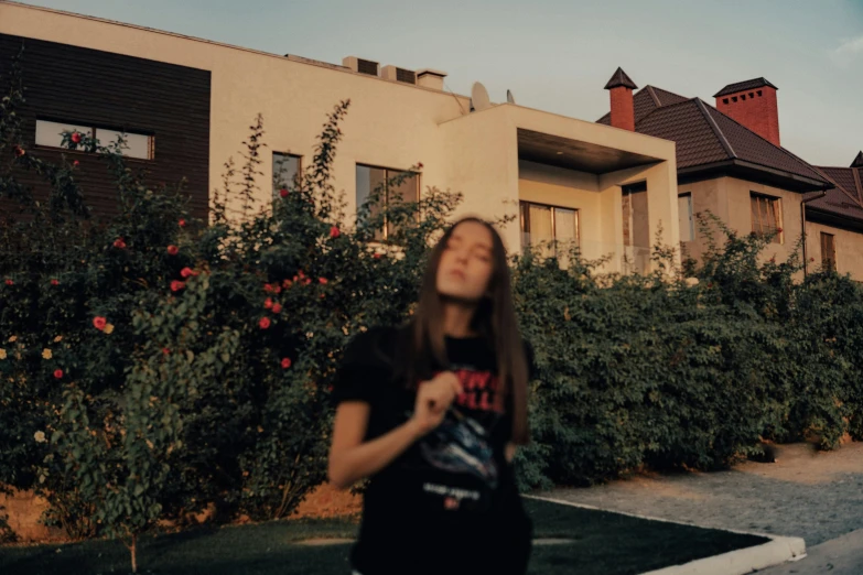 a young woman in front of a very big building