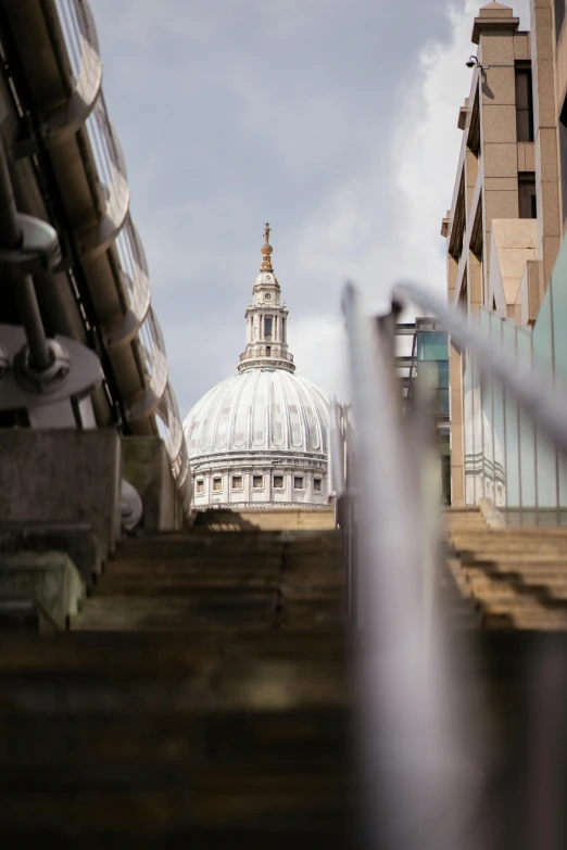 stairs lead up to a dome behind glass