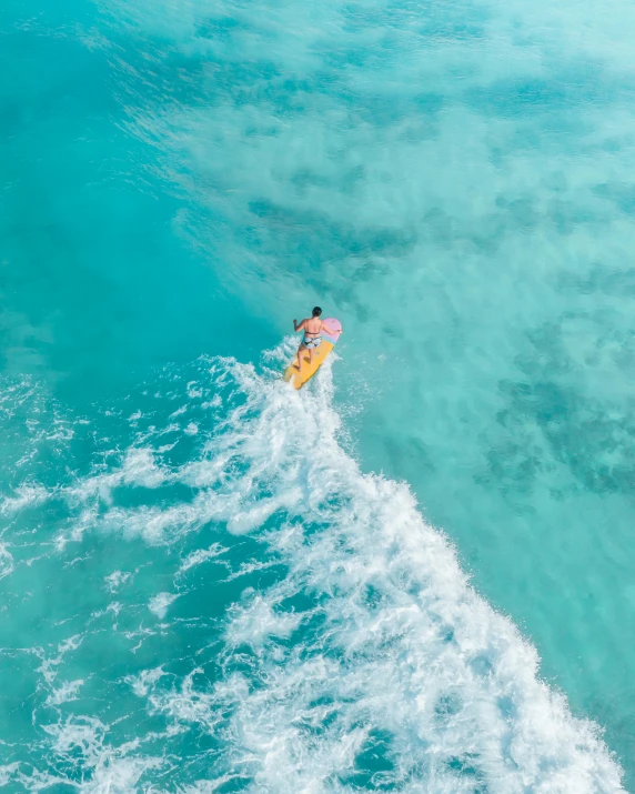 the surfer is riding through the blue waters