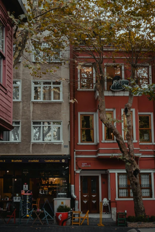 a red brick building with lots of windows on the top floor