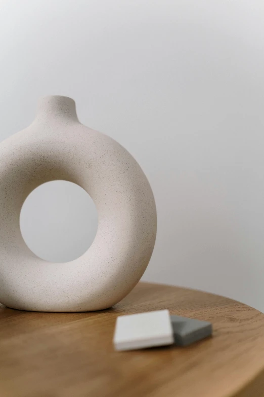 a white ceramic object sitting on top of a table