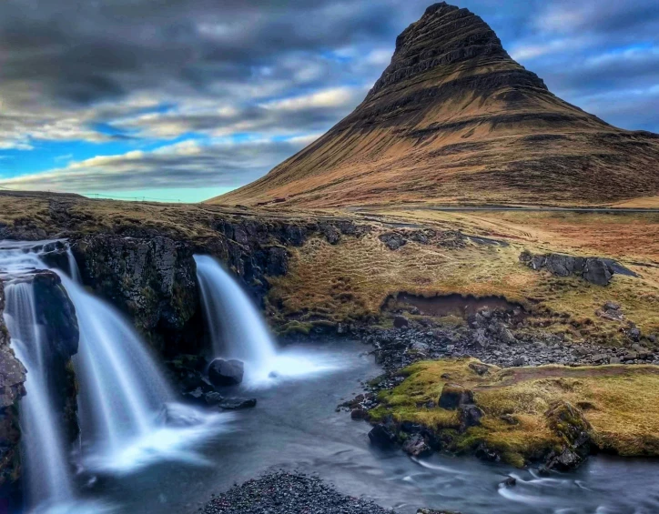 some water falls are in the water and grass