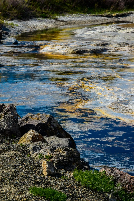 a body of water sitting between two rocks