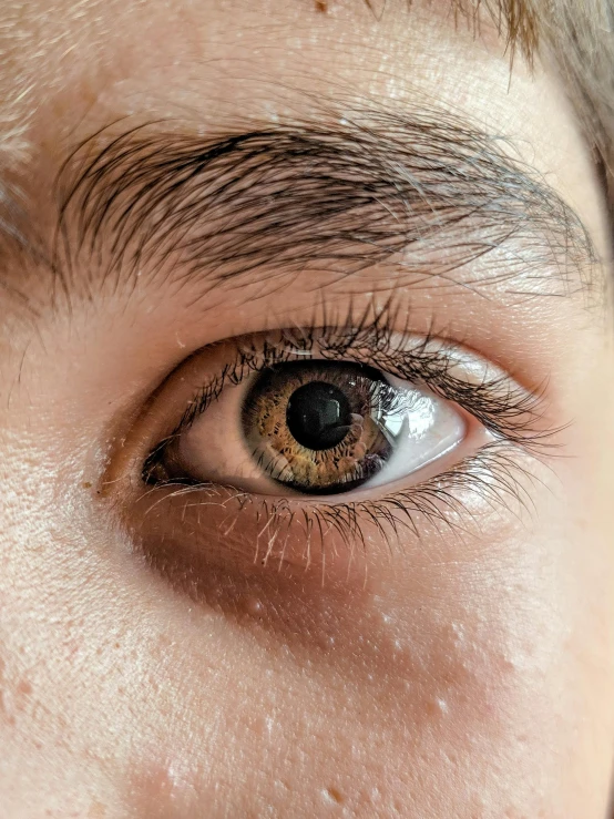 a close up of a persons eye with the lashes of the eyes