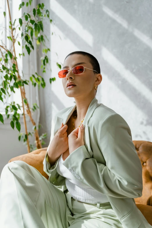 woman sitting and adjusting her clothes with plant