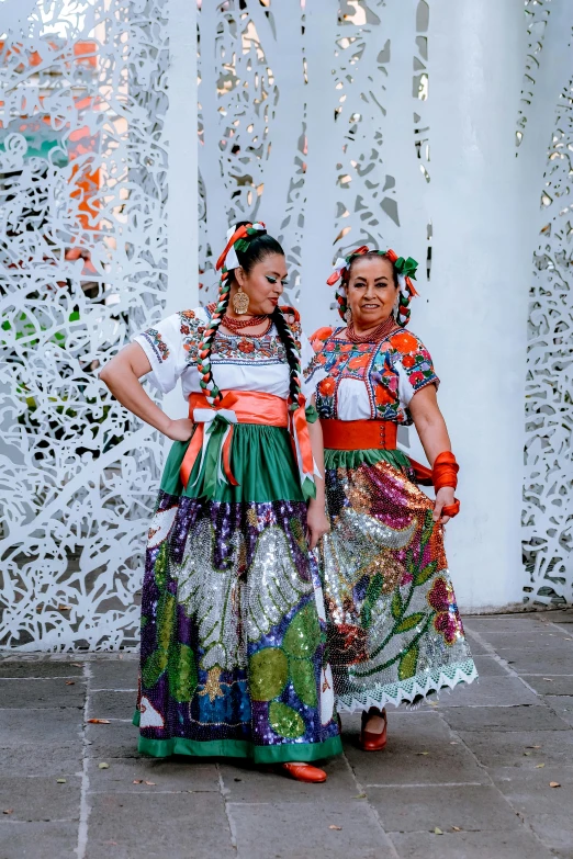 a couple of people that are standing near a building