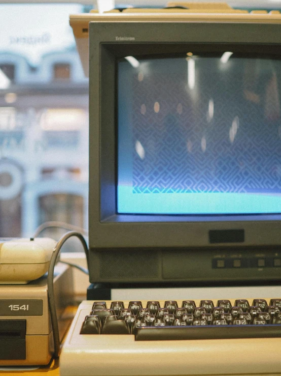 an old fashioned laptop computer sitting on top of a table