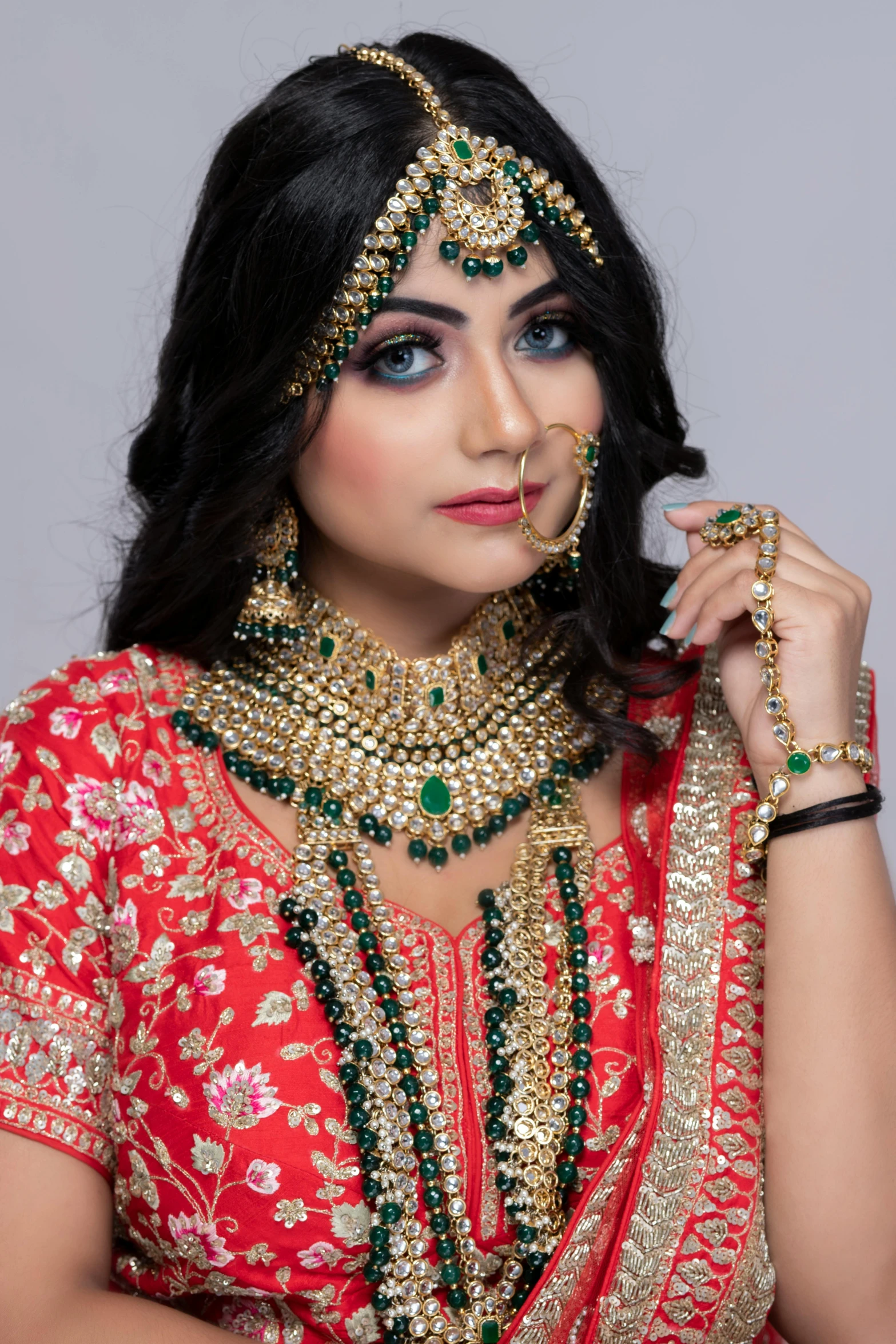 an indian woman with jewelry on her face