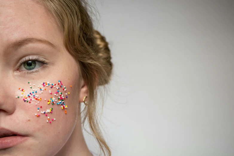 woman with sprinkles all over her face