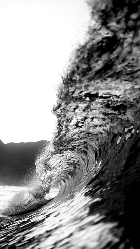 a person surfing the waves on the beach