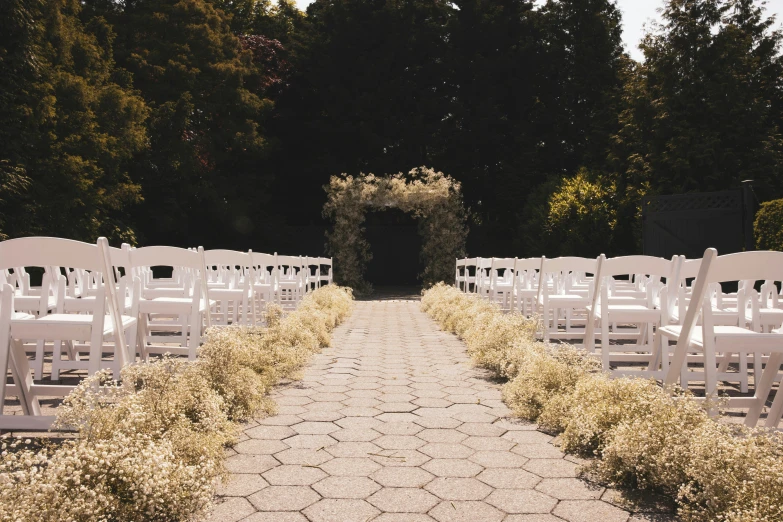 a view of a long line of white chairs