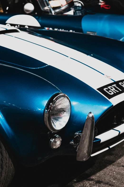 a closeup of a vintage ford gt35 race car in color