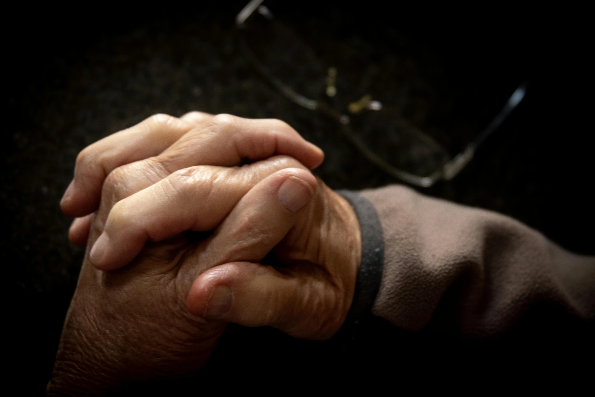 there is an image of two hands clasped