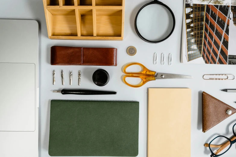 craft supplies laid out on a table for making paper