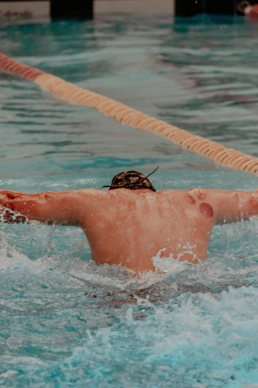 someone in the water playing with a swimming board