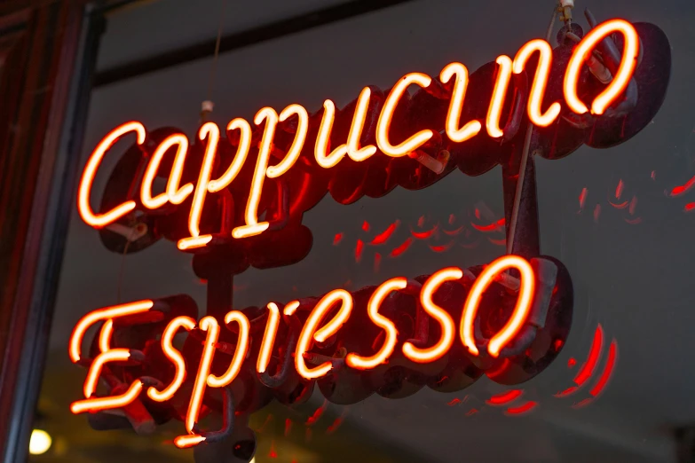 close up of a neon sign advertising cappucino espresso
