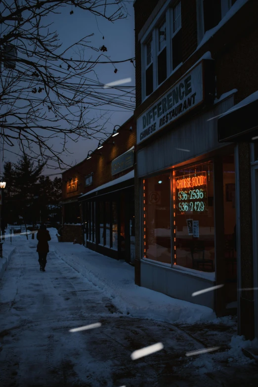 a street at night with people walking by it