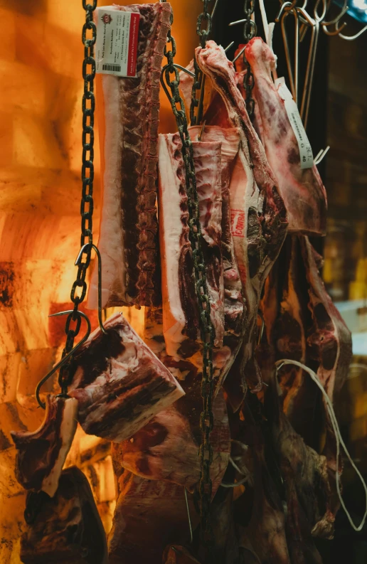 meat that is being prepared and attached to chains