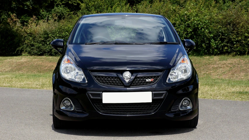 a black car parked on the side of a road