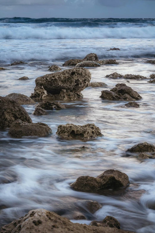 the water is rushing over rocks and land