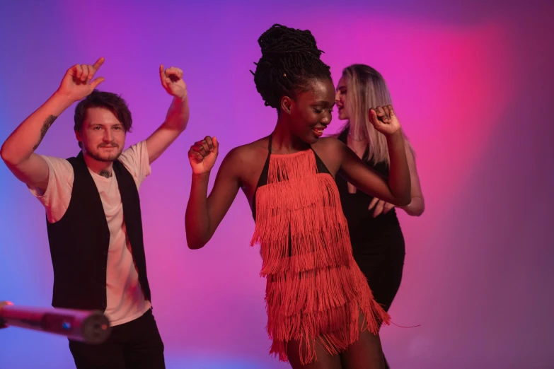 two women and one man dancing