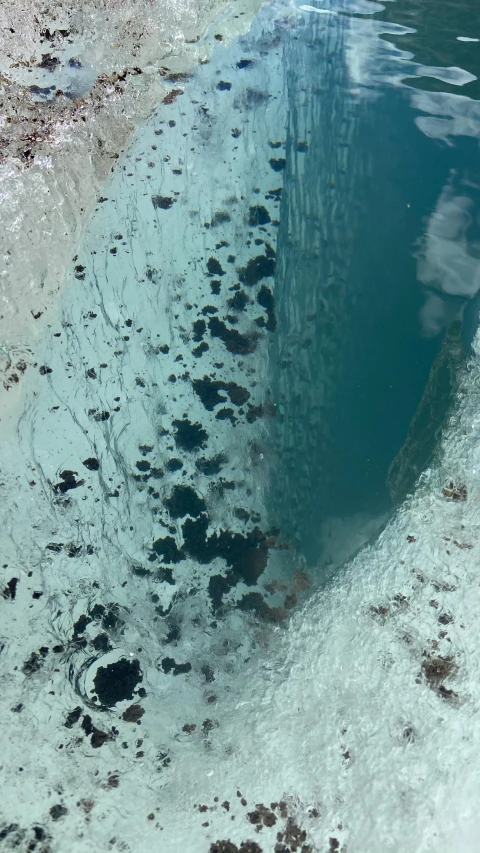 view from the air showing water and rocks