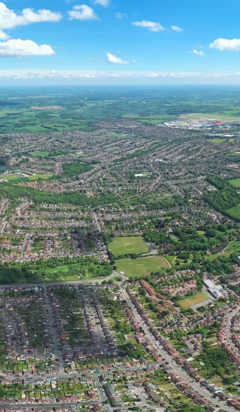 a city is shown from above on a sunny day