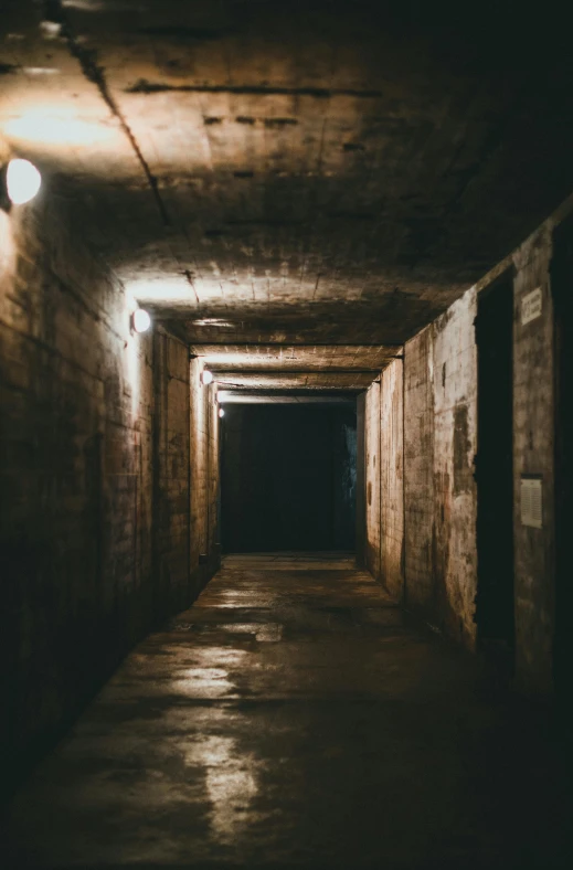 an alley with a bunch of doors leading to the exit