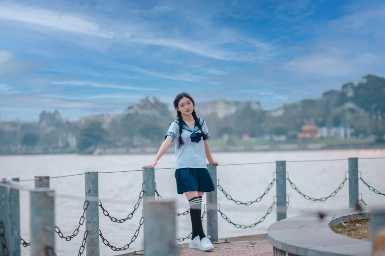 a woman standing on top of a wooden deck