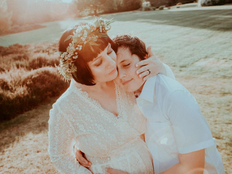 a young woman emcing the chest of an older man on her wedding day