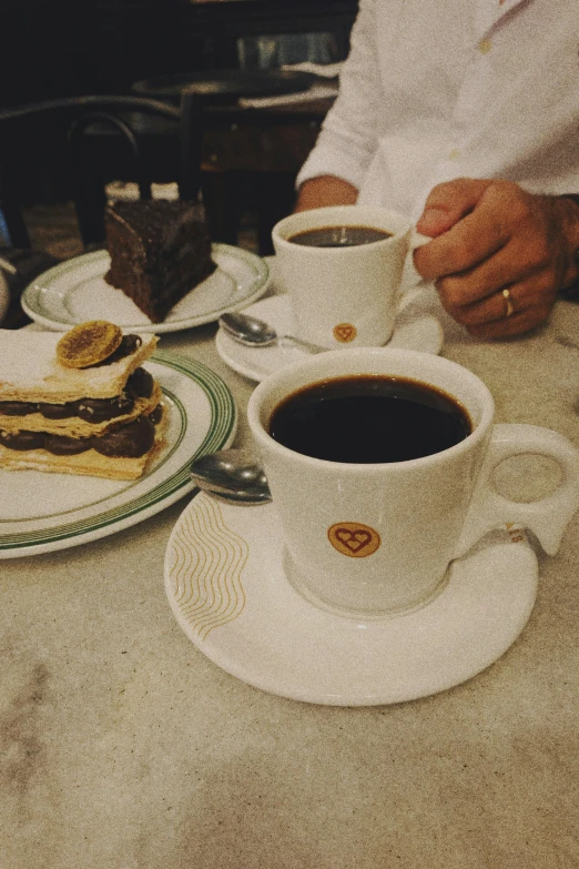 coffee and peanut er in a cup sitting on a table