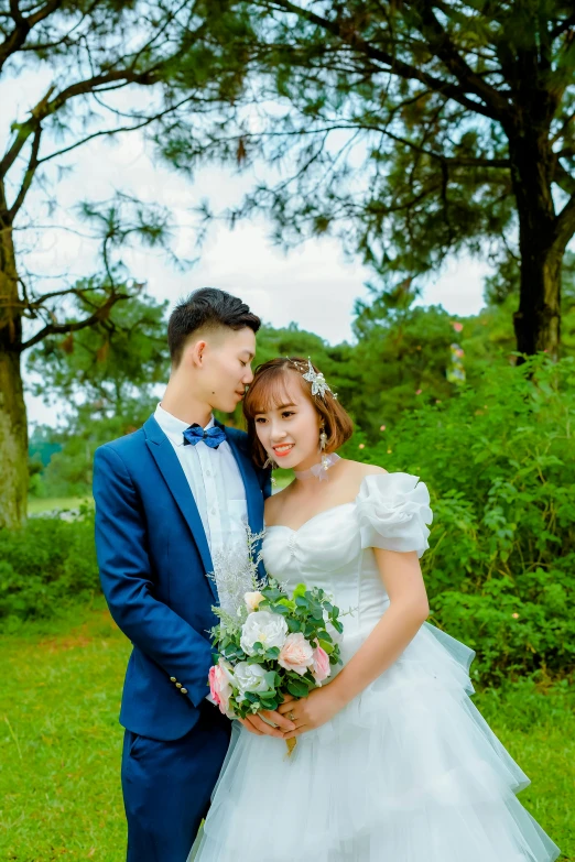 a bride and groom are posing for the camera