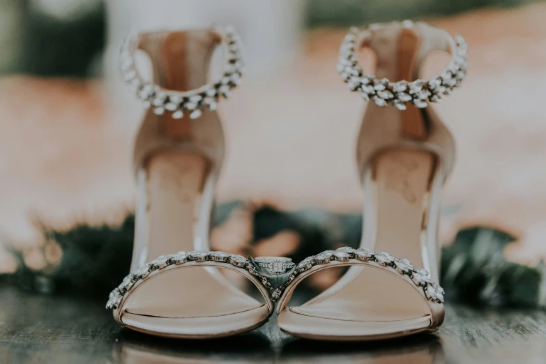 shoes with high heels are lined up on the table