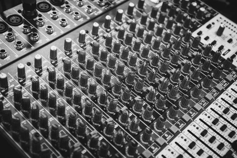 black and white pograph of an audio mixer