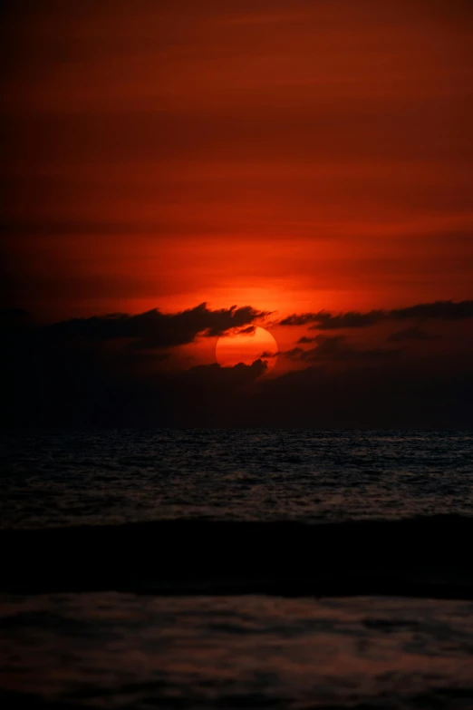 a picture taken from the beach during a sunset