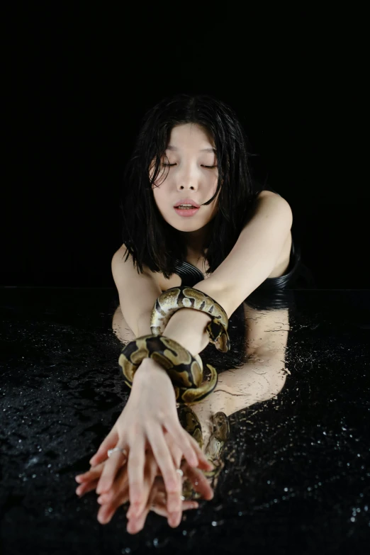 a woman with black hair and white snake skin