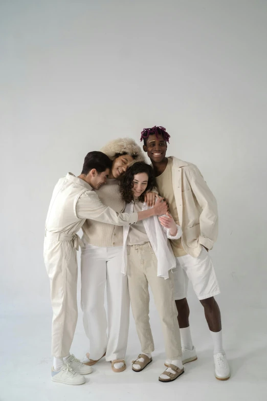 four people pose for a picture in the same group