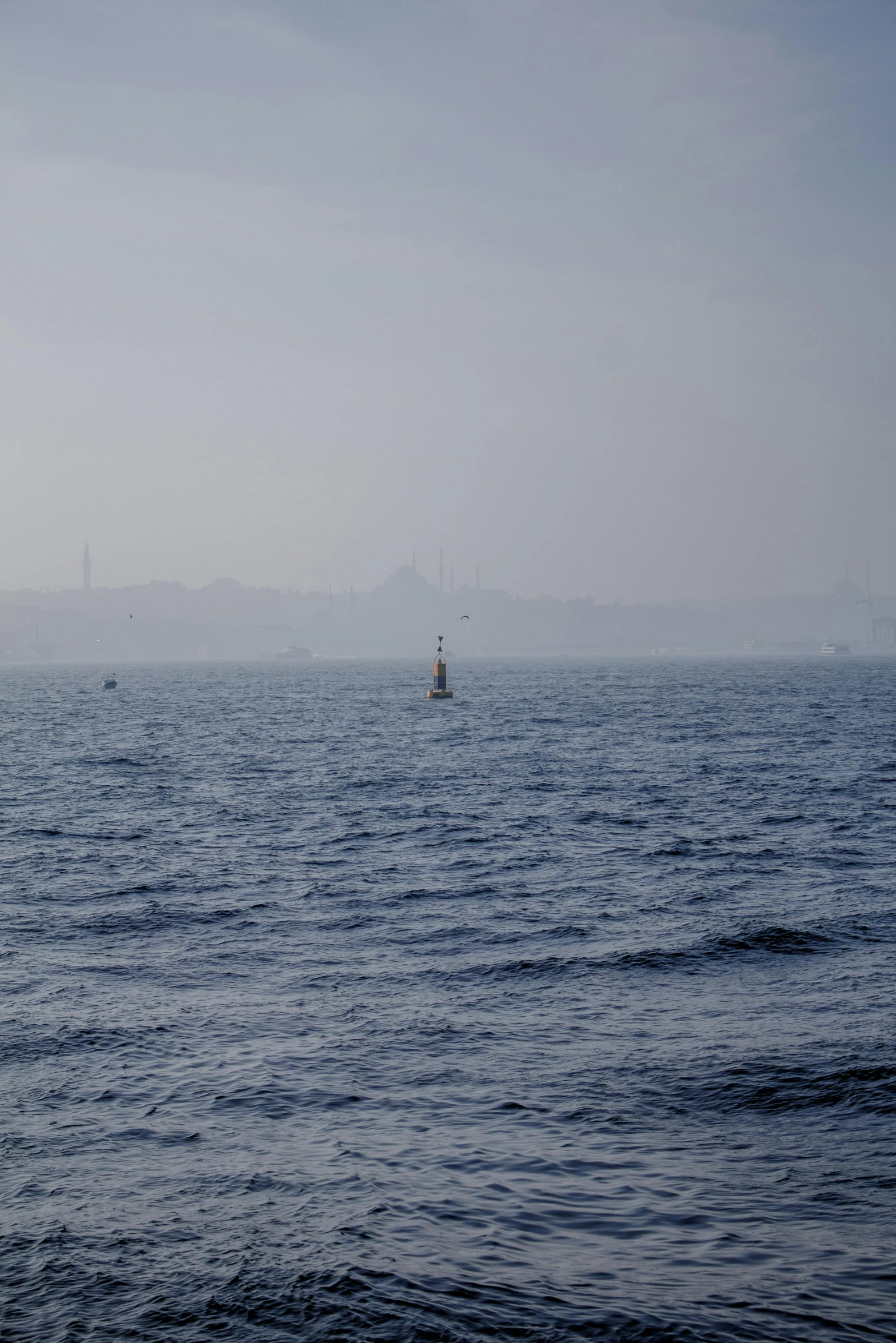 a group of boats in an open body of water