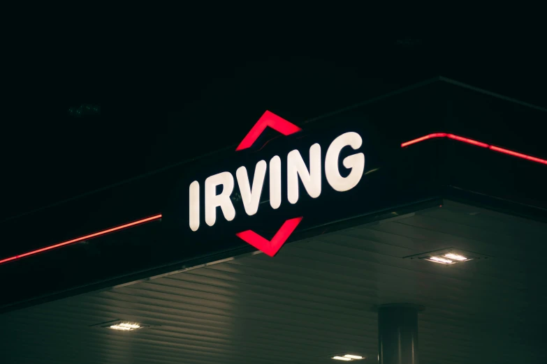 an i irving street sign at night lit up