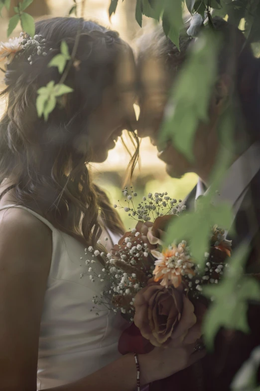 there are two people standing together wearing wedding attire