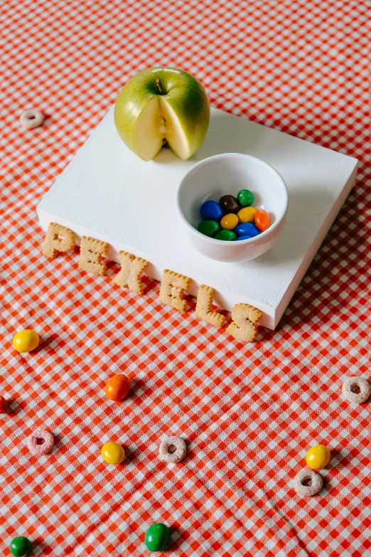 a bowl with some fruit sitting on a tray