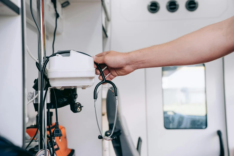 a person is using an electric cord for wires