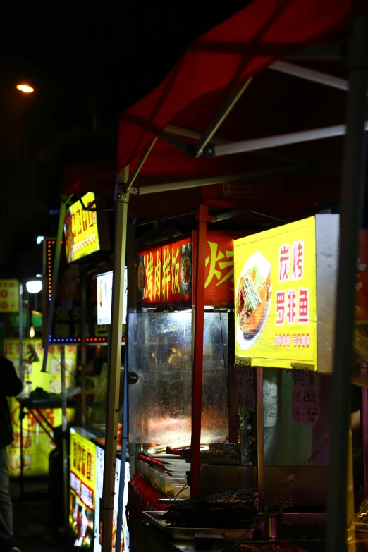 some kind of food stand that has some signs