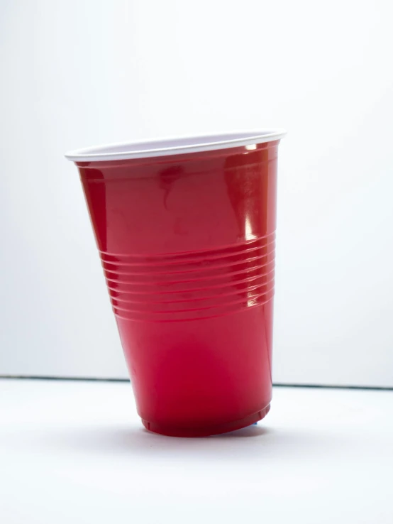 the red plastic cup is slightly tilted to the side