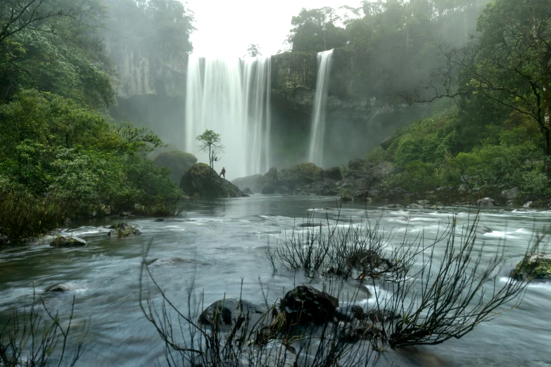 an image of a waterfall that is in the middle of the day