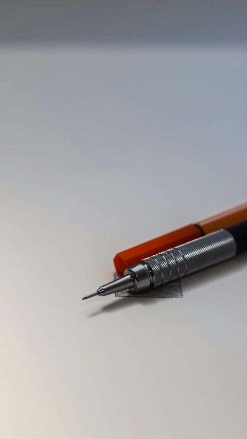 a pen that is writing in on a table