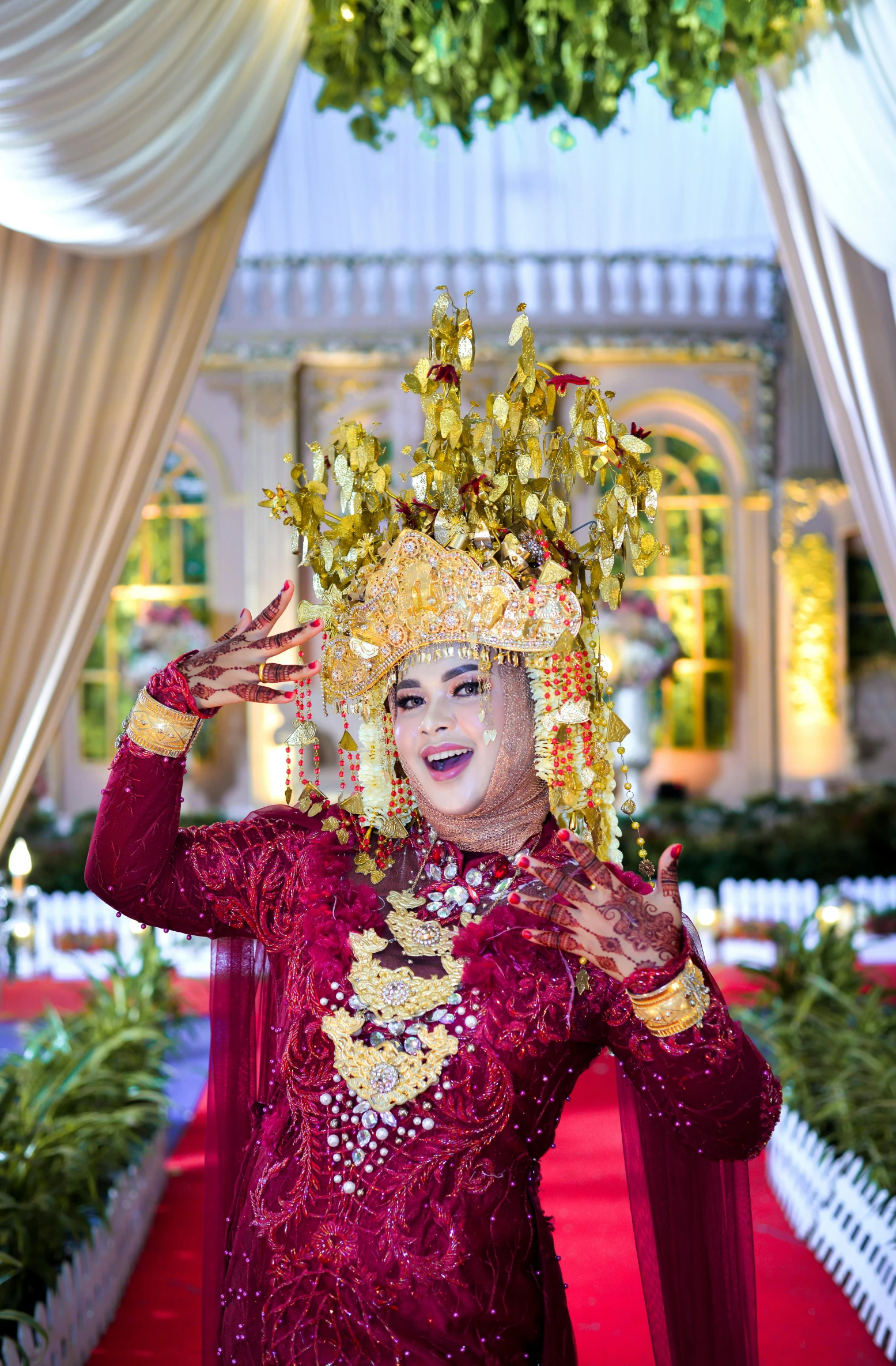 a woman dressed in an elaborate costume on a red carpet