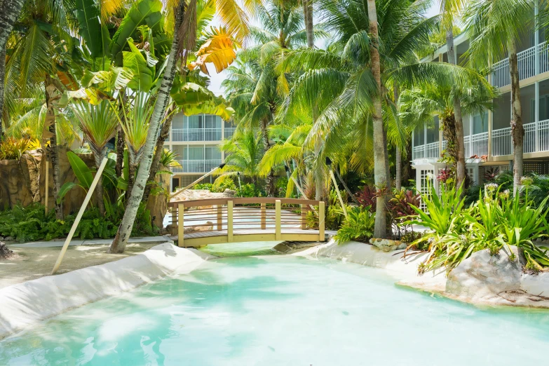 the pool and walkway leading into the outdoor resort