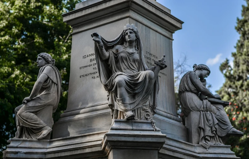 a group of statues are standing next to each other