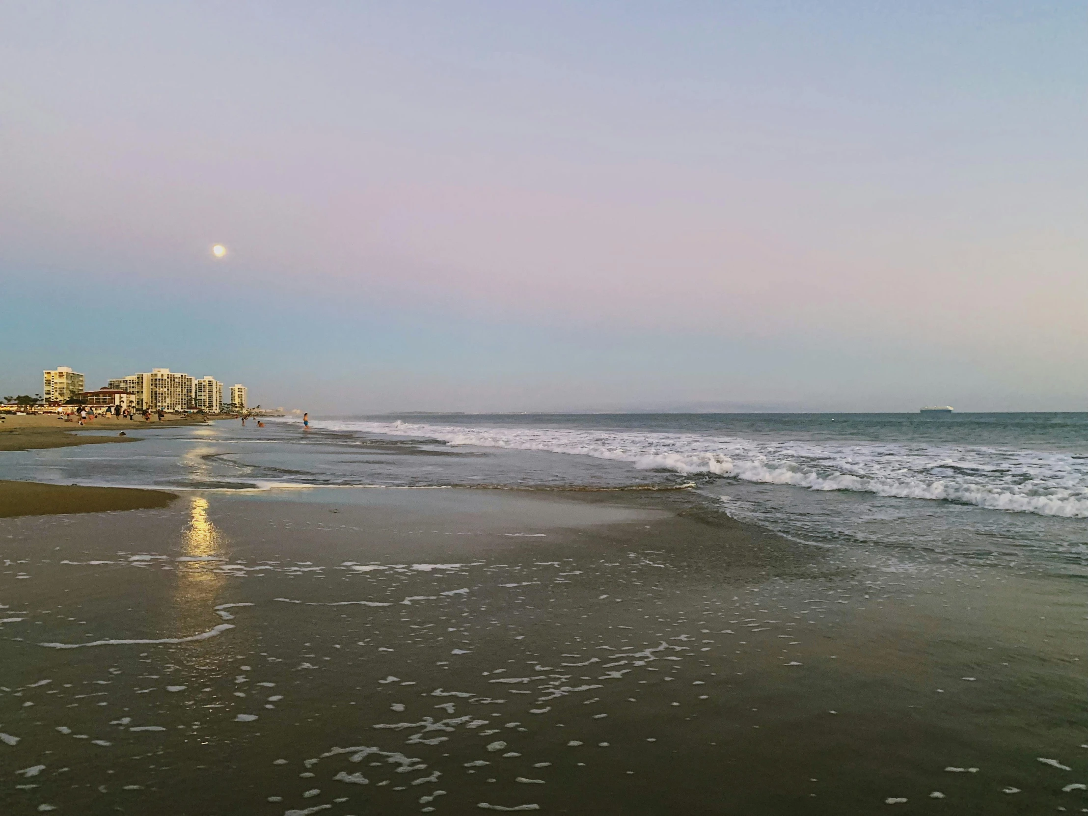 a full view of the beach with the water